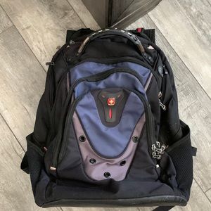 Black and blue Swiss gear backpack with large capacity.